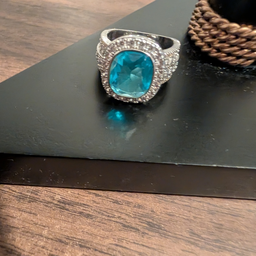 Beautiful Turquoise Ring With Diamonds Around It